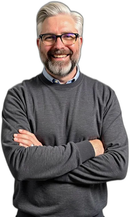 Jeremy Kenerson, Founder and CEO of DeskTeam360, arms crossed and smiling